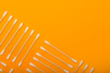 Cotton swabs on color background