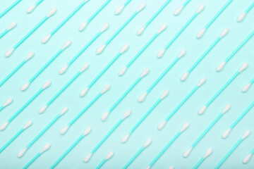 Cotton swabs on color background