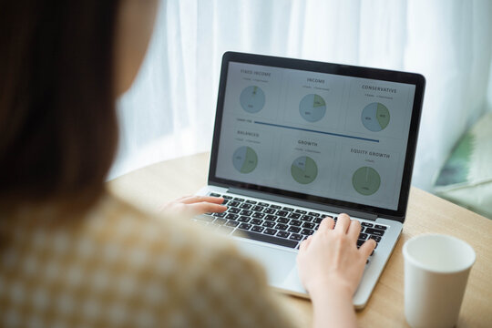 A young female officer summarizing data to create into an infographic for presentation