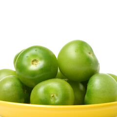 Green tomatoes on white background