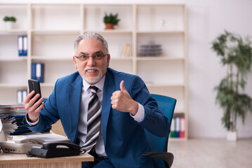 Old male employee and too much work in the office