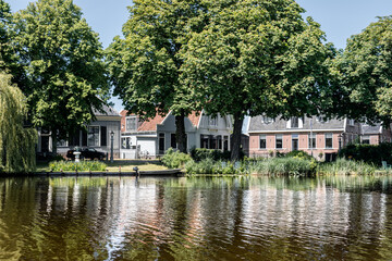 Fototapeta na wymiar Dutch houses in the typical Dutch town Broek in Waterland, the Netherlands
