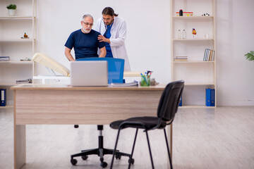 Old male patient visiting young male doctor