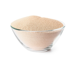 Bowl with active dry yeast on white background