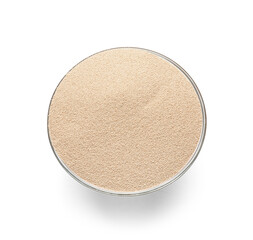 Bowl with active dry yeast on white background