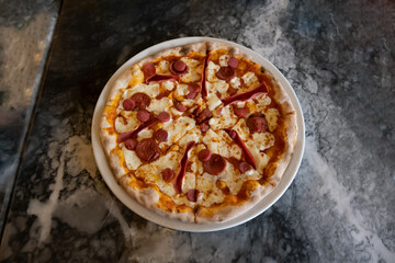 pizza on marble floor, top view