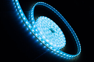 a skein of blue LED strip on a black background