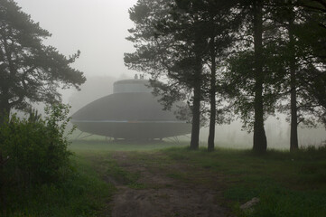 Alien flying machine in a clearing in the forest