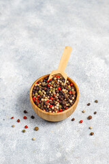 Various peppercorns in mini bowls.