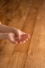 Hands on the wooden table