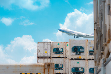 Cargo airplane flying above logistic container. Air logistic. Reefer for frozen food. Refrigerated...
