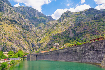 Montenegro, Old Town of Kotor.  View of Skurda river and northern walls of ancient fortress on sunny summer day