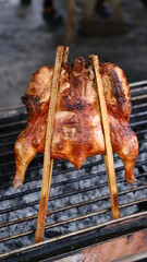 Roasted chicken on grill barbecue ,chicken on stove  Thai local street food.