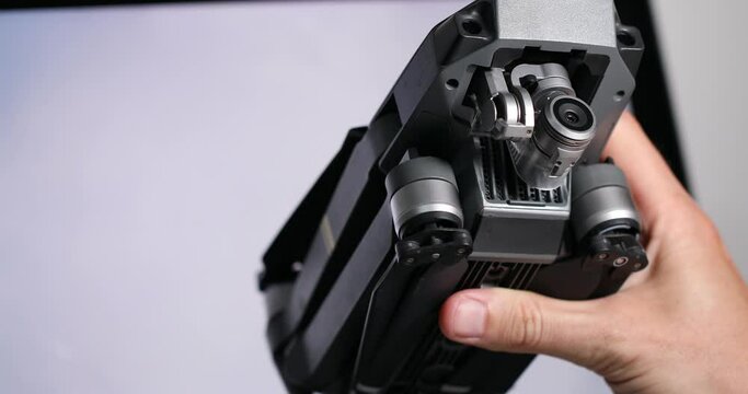The protective case for the quadcopter camera is opened by the hands of a man. High quality 4k footage