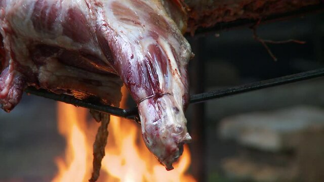 Barbecue lamb over hot coal fire