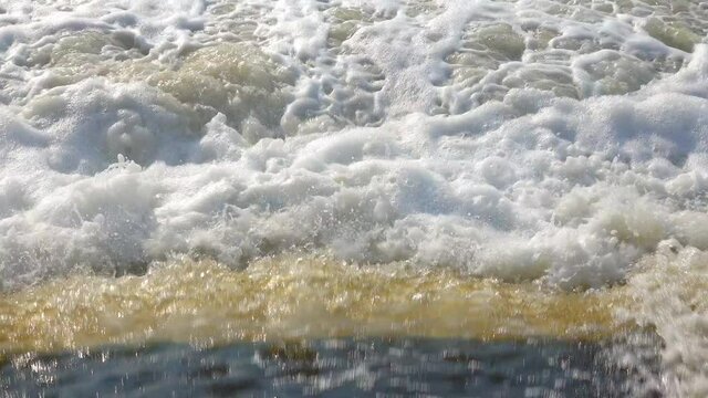 Dirty poorly treated water from the treatment plant flows into a natural reservoir, Khadzhibey estuary, Ukraine.