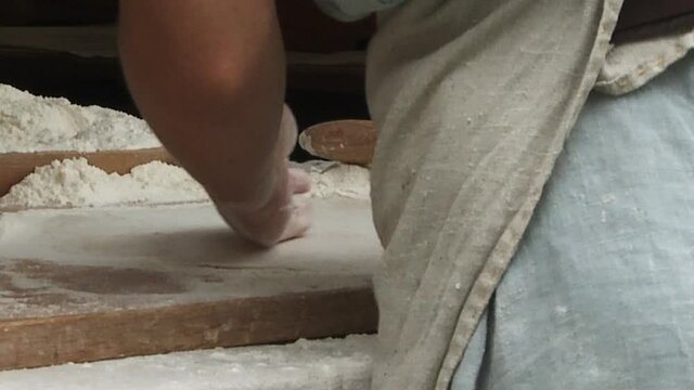 Baking bread old style on the event medieval week in the city of visby on the island Gotland in Sweden