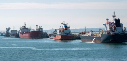 England, UK. 2021.  Chemical, gas and oil tankers alongside a refinery jetty
