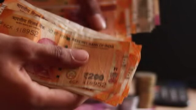 Indian currency close up view,a man recounts indian rupee money,counting Indian currency notes,all indian currency (rupee),Counting and handeling money,