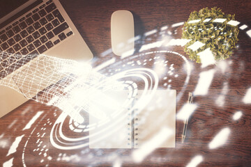 Double exposure of data theme drawing hologram over topview work table background with computer. Concept of technology.