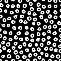 Seamless pattern, white abstract dots on  black background. Design vector of fabrics, covers, dishes and more.