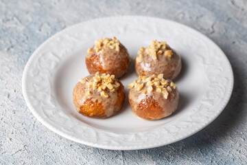 Traditional delicious Turkish dessert; Tahini and hazelnuts on Kemalpasa dessert