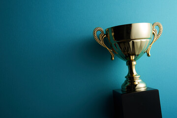 Fototapeta golden trophy on blue background obraz
