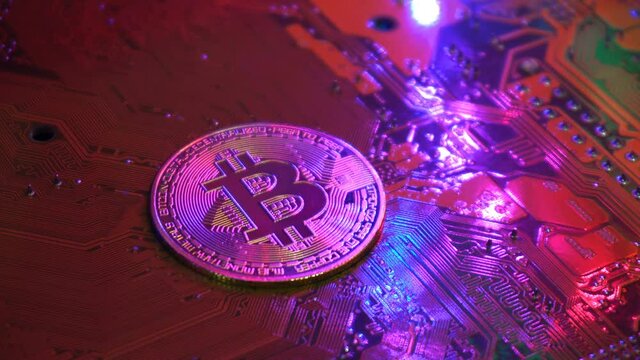 Golden bitcoin coin on server computer motherboard It is the currency that is exchanged and popular today in every country in the world. Concept business technology. Copy spece background