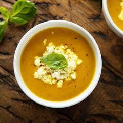 Healthy homemade pumpkin soup with cheese