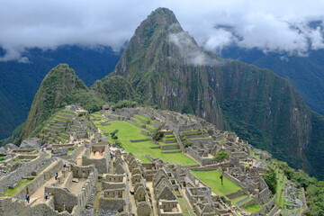 Peru Machu Picchu - Aerial view of Machu Picchu ruins with green mountains