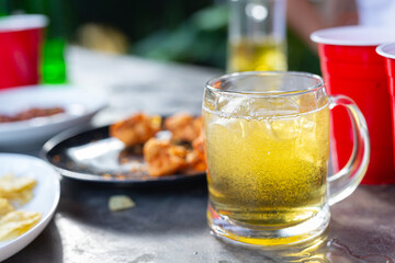 Beer party with friends at home, International Beer Day concept.