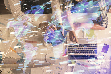 Double exposure of man and woman working together and data theme hologram drawing. Computer background. Top View.