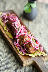 Traditional homemade kebab with pikled onion