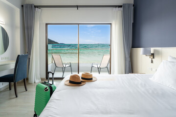 Luxury sea view hotel room with baggage, Travel concept - obrazy, fototapety, plakaty