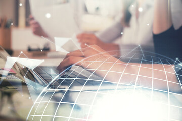 Double exposure of woman hands working on computer and world map hologram drawing. International technology business concept.