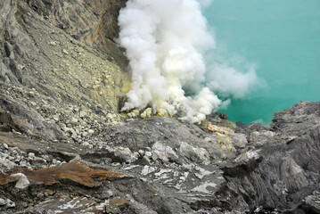 Kawah Ijen volcano and sulfur lake is composite volcanoes in the Banyuwangi Regency of East Java, Indonesia, Kawah ijen have Blue fire crater and Sulfur mining. Blue nature scene park and outdoor 