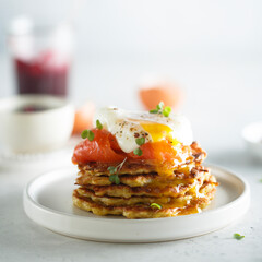 Traditional homemade potato pancakes with poached egg