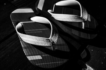 Black and white flip flops