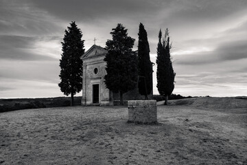Chapel Capella della Madonna di Vitaleta in Tuscany, Italy at Sunrise or Dawn in Monochrome Black and White