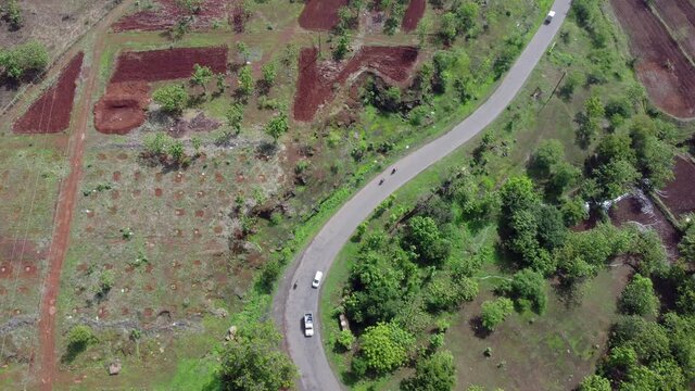 Aerial footage of a road with traffic at village Bhor near Pune India.