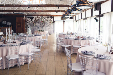 A empty dining room decorated in red fabric.