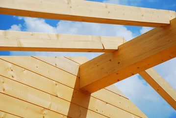 Main roof beam detail on a partially constructed wood (fir) block house, a pre-cut wooden house...