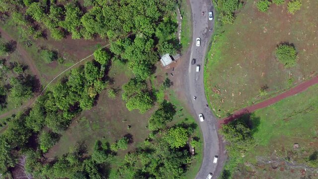 Aerial footage of a road with traffic at village Bhor near Pune India.