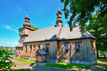 Wooden church in Rogi village near Miejsce Piastowe, Poland in summer sunny day