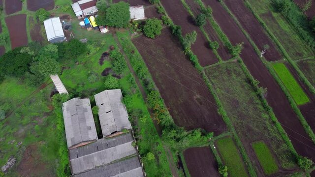 Aerial footage of rural monsoon landscape at Bhor near Pune India.