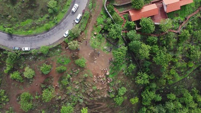 Aerial footage of a road with traffic at village Bhor near Pune India.