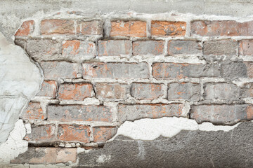 Textured red brick wall from old stones