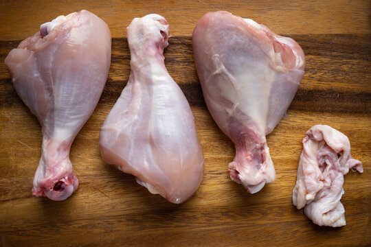 raw uncooked skinless chicken leg