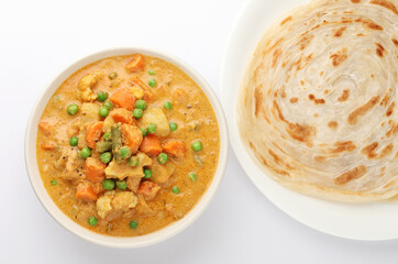 Malabar parotta with kurma, paratha kurma is a delicacy from the state of Kerala, tamilnadu south India. kurma is mixed veg south Indian curry
