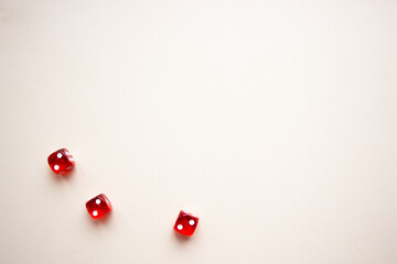 three dices red color on light background